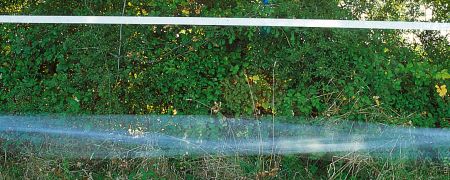 Our electric fence tape for horses let the wind pass through the tape that stays quiet in the wind;